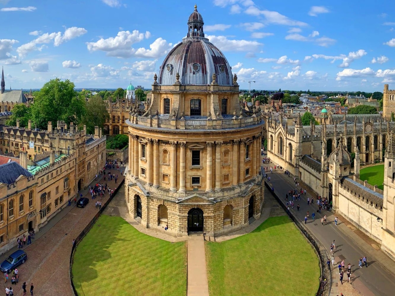The Radcliffe Camera and All Souls College seen from above, Oxford, under a blue sky