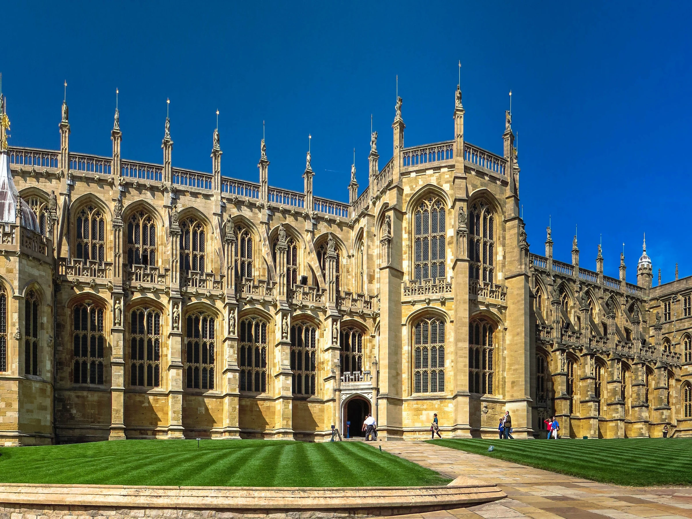 The west front of St George's Chapel at Windsor Castle under a blue sky
