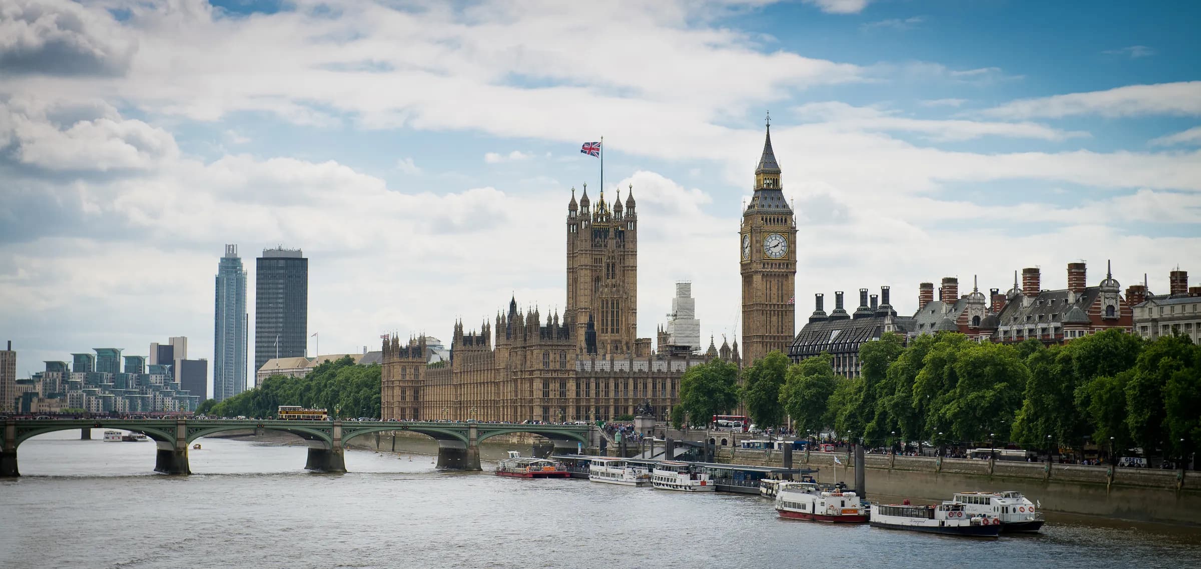 The Houses of Parliament and Big Ben seen across the Thames from Westminster Bridge
